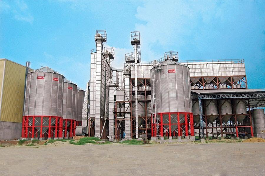Storage silos and dryer towers in the plant yard
